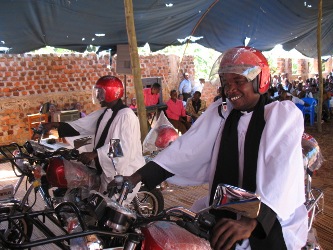 Priests on motorcycles after dedication in church