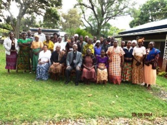 2- Bishop Mwita with women farmers after training