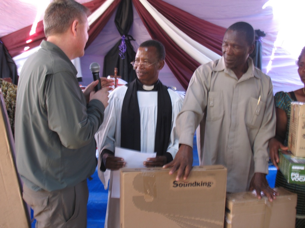 Canon Bwiru of Mogabiri and some vestry members receiving the instruments