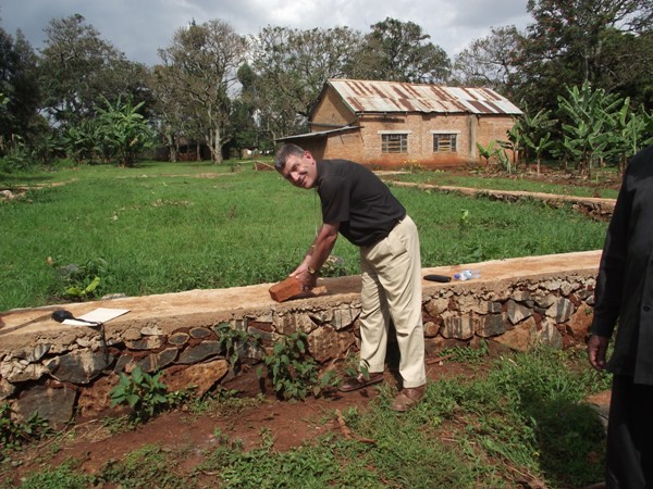 Bishop Stephen laying a brick at the new church to be built at St Paul's Church at Mogabiri.